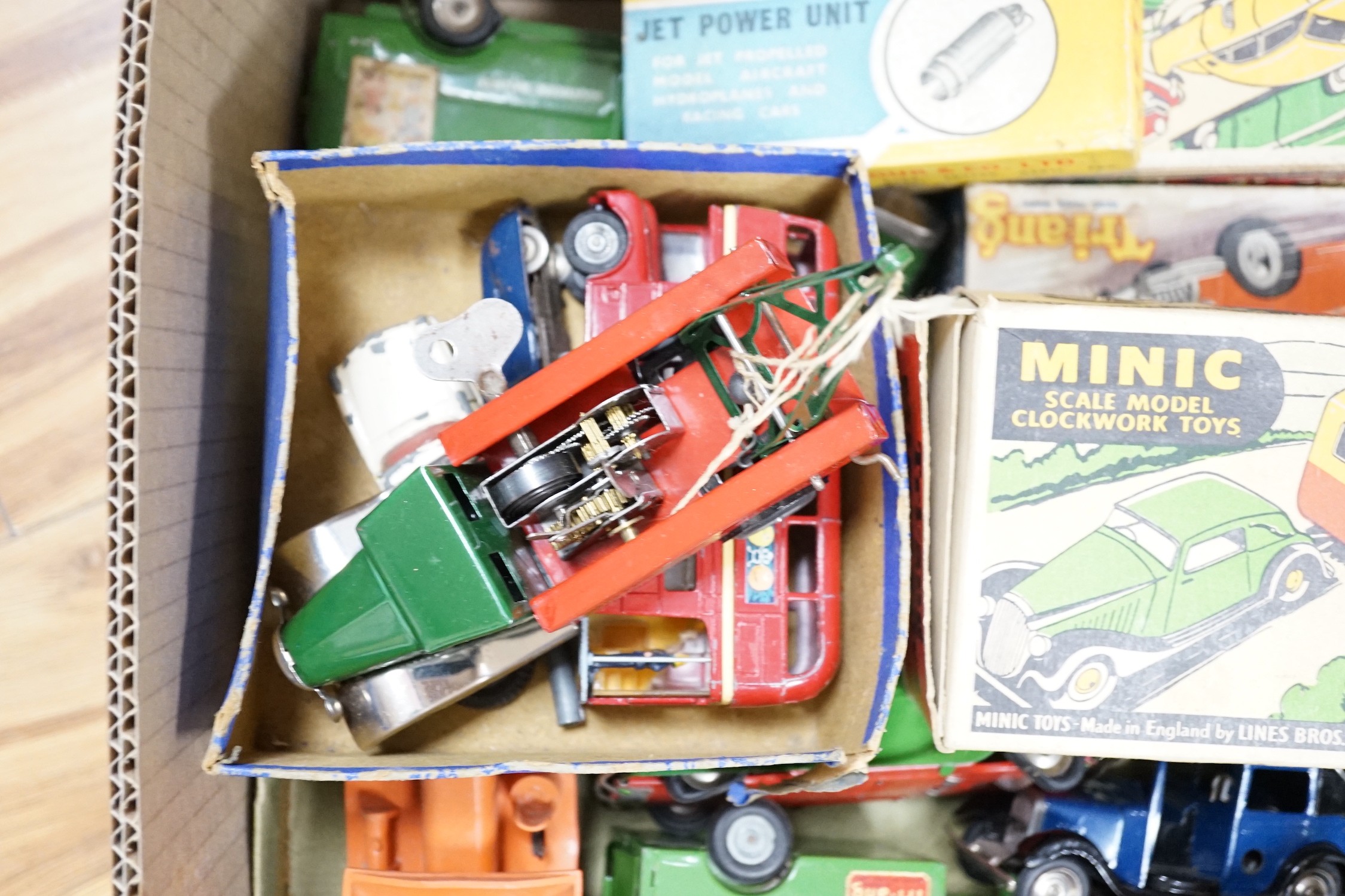 A collection of tin plate model vehicles, to include a boxed Tri-ang model of a Vauxhall Cabriolet & caravan from the Minic clockwork toys collection, and others
